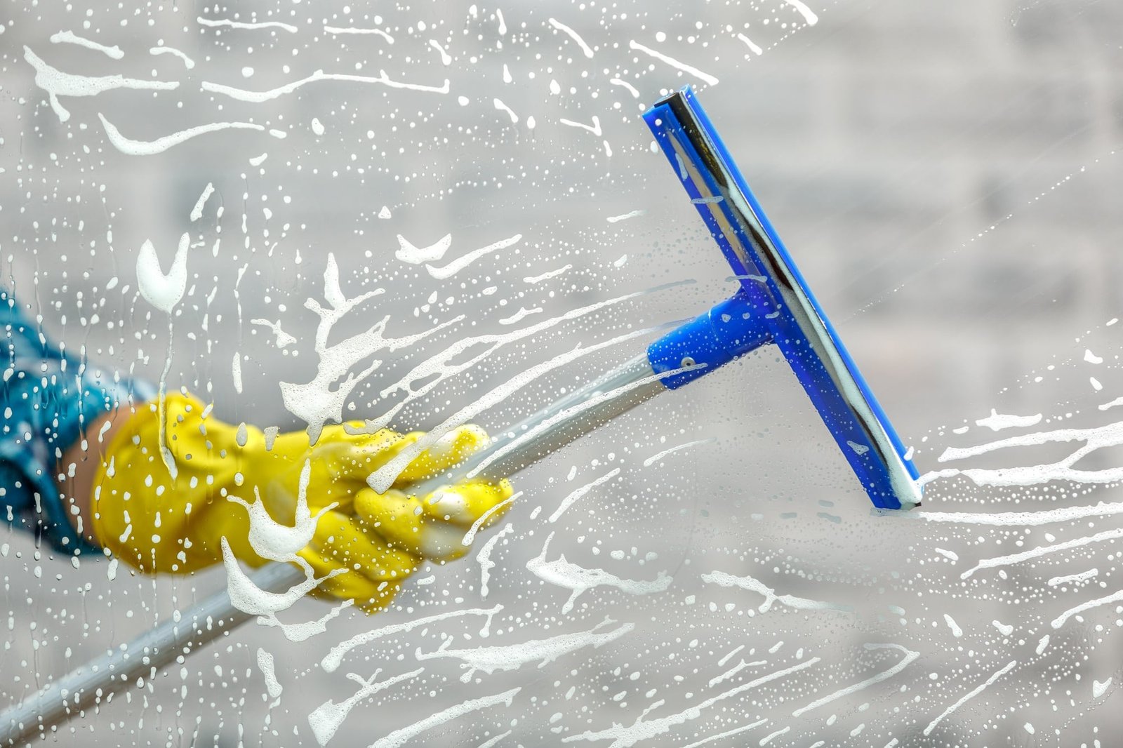 Essential Cleaning NJ professional cleaning windows with eco-friendly products